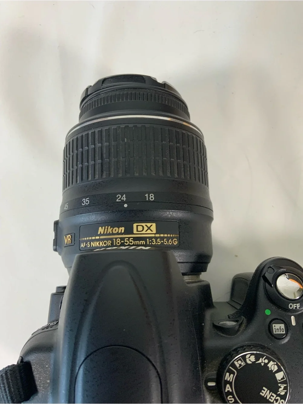 Nikon DSLR Camera with Black Body and Yellow-Orange Interior Bag